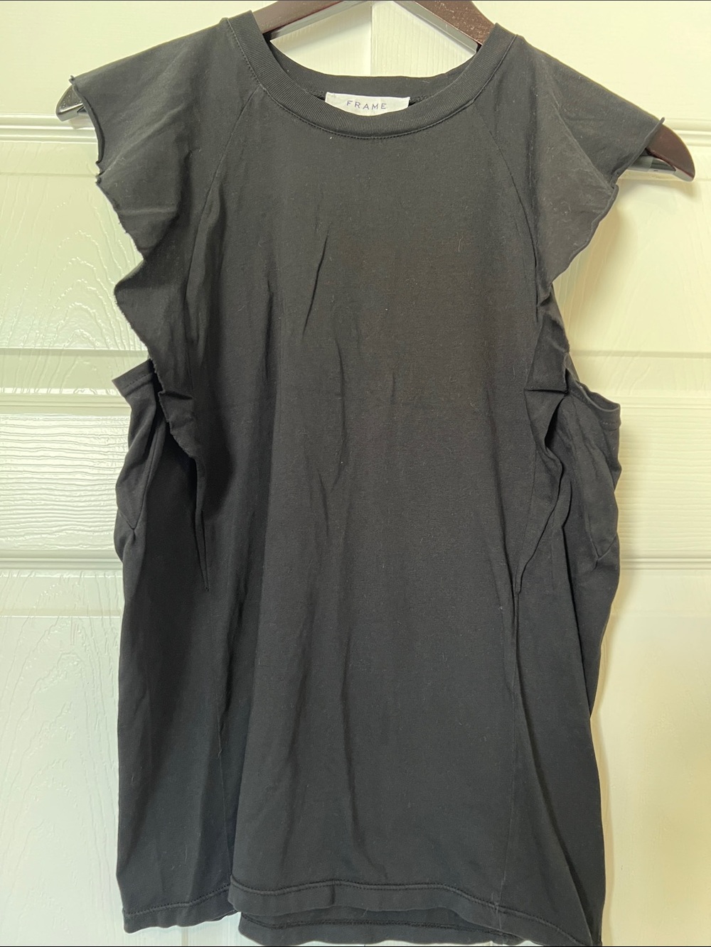 Black Frame sleeveless tee with shoulder ruffle. Size small